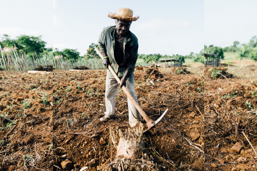 African man digging