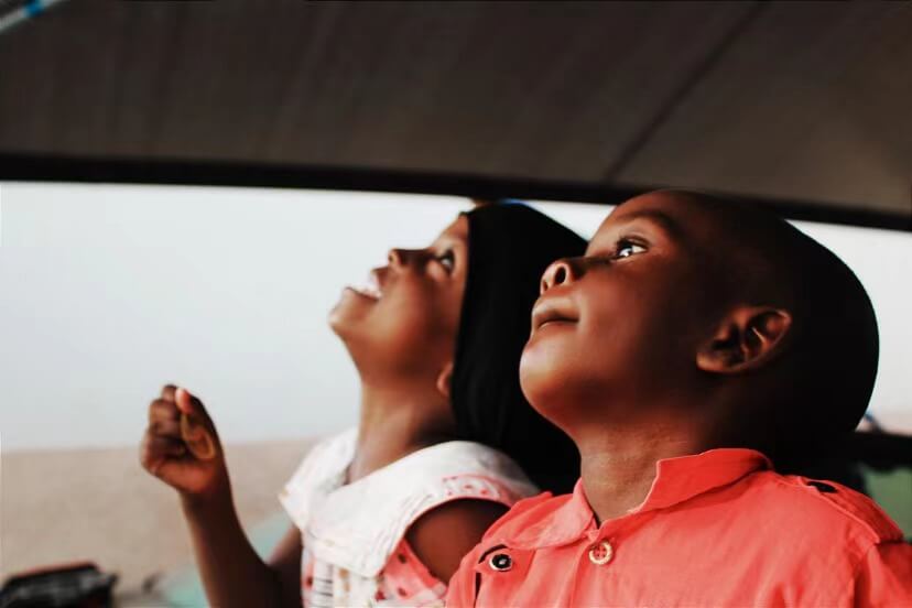 An African boy and girl staring up