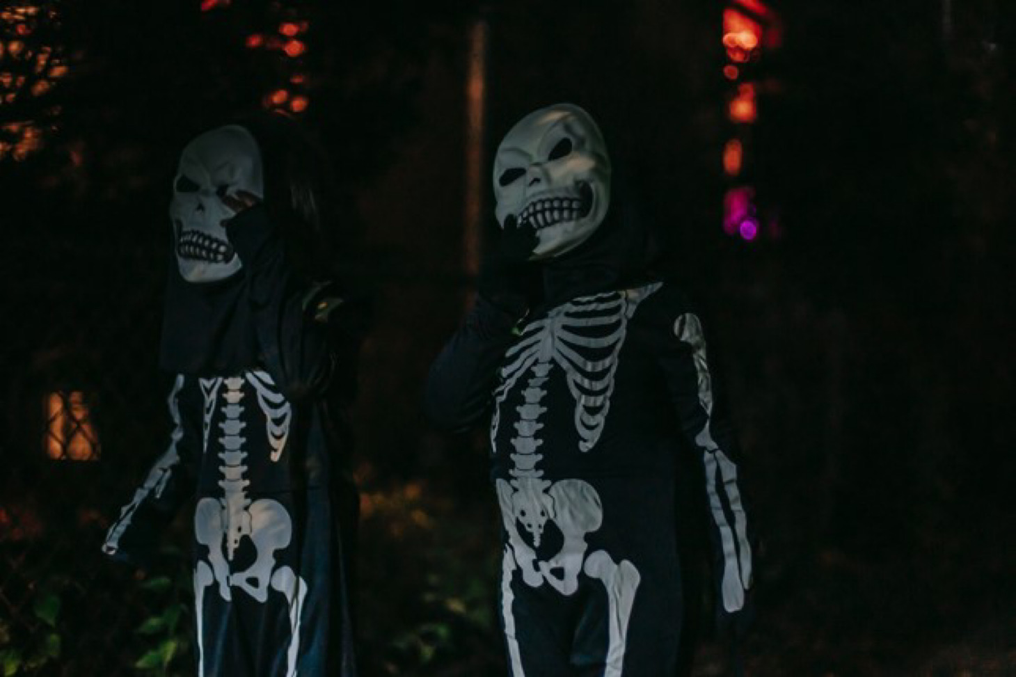 two people dressed in scary costumes.