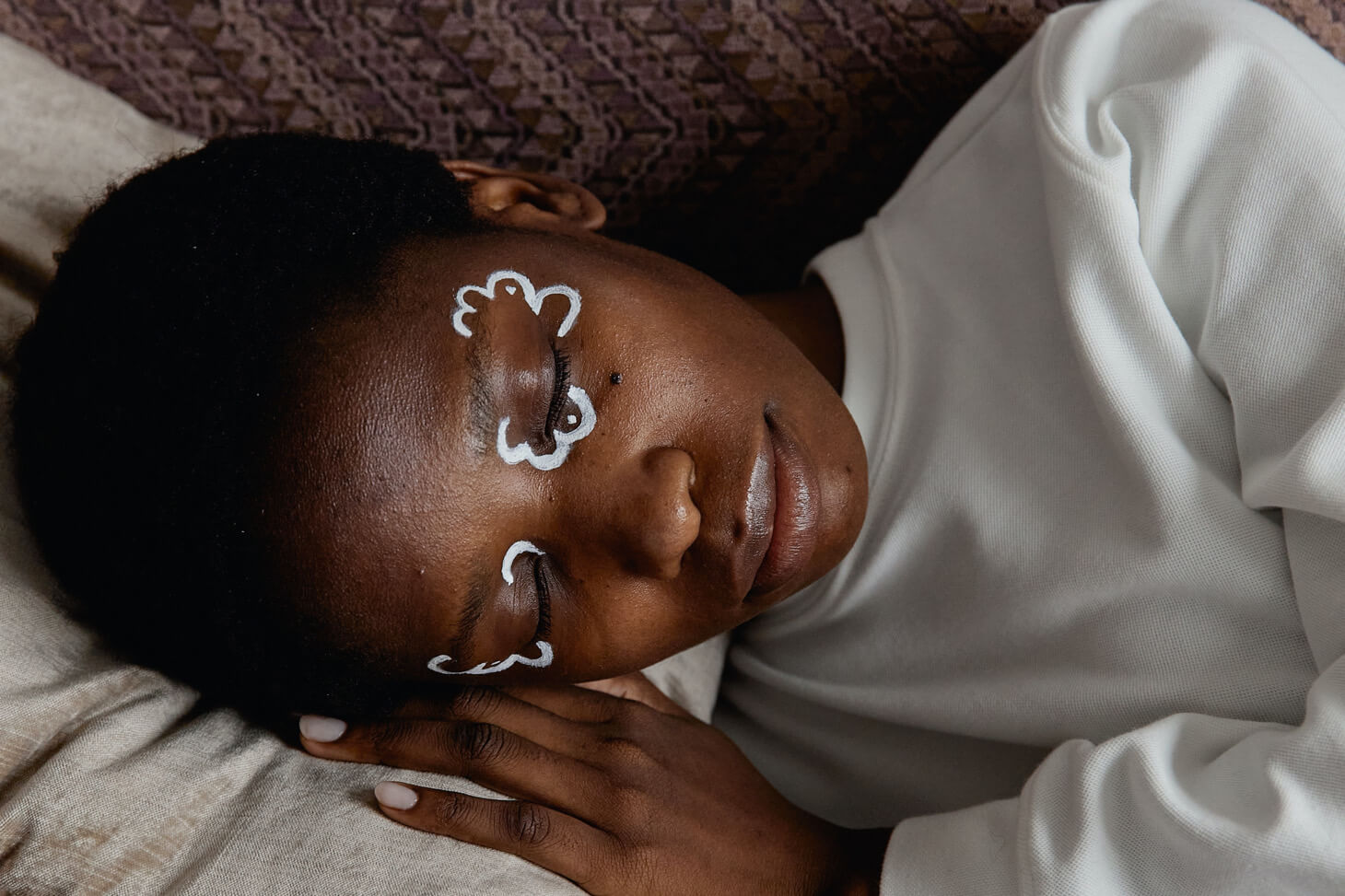 An African woman with face paintings.