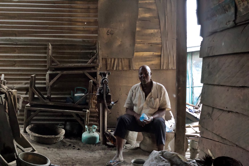 African man sitted down.